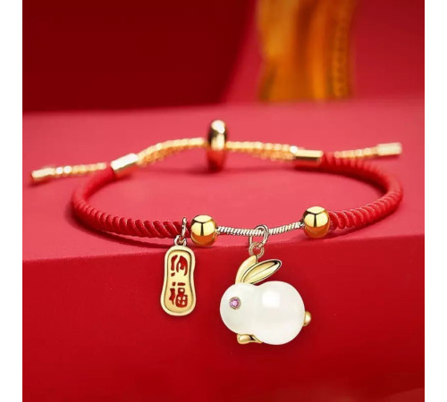 Браслет Нефритовий Кролик на червоній нитці з позолотою 24 каратів приносить любов, романтику, партнерство удача